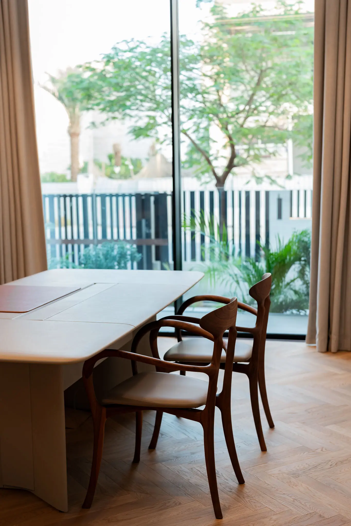 Editorial interior dining and garden view — luxury Dubai villa